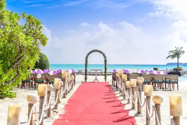 Tropical beach wedding aisle with chairs
