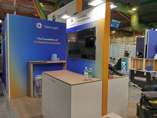 Technology demonstration screen on an ECOC 2026 exhibitor stand